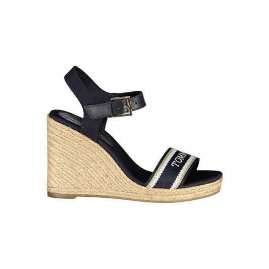 Wedge Sandals by Tommy Hilfiger for women in polyester polyurethane leather blue features an architectural design from the Women's Polyester Polyurethane Leather Wedge Sandals collection, defined by a architectural wedge and for a architectural finish.
