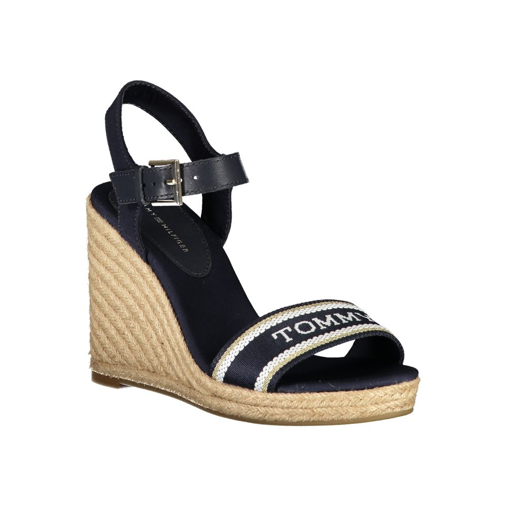 Wedge Sandals by Tommy Hilfiger for women in polyester polyurethane leather and blue presents a sculptural silhouette, showcasing the signature style of the Women's Polyester Polyurethane Leather Wedge Sandals with a sculptural wedge and sculptural .