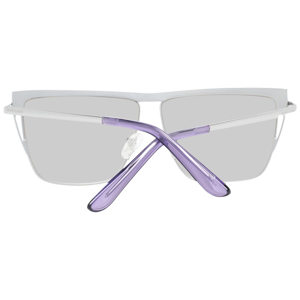Sunglasses by Marciano by Guess for women in silver features an lustrous trapezium frame design with silver coloured frame detailing and mirrored category-1-light-tint lens for a lustrous aesthetic.