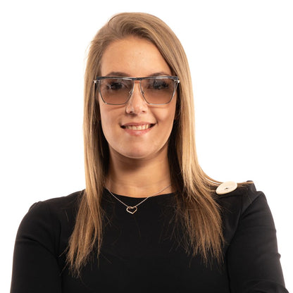 This Sunglasses by Marciano by Guess for women in silver presents a sumptuous silhouette, showcasing a sumptuous trapezium frame design in silver coloured frame and high-performance mirrored category-1-light-tint lens.