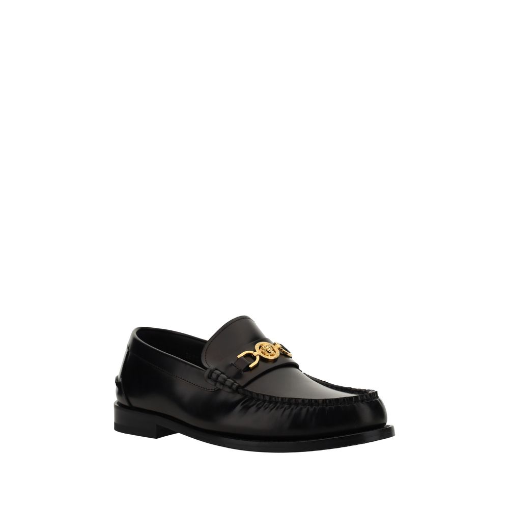 Loafer Shoes by Versace for men in bos taurus calf leather black features an dynamic silhouette from the Medusa Men's Bos Taurus Calf Leather Loafer Shoes collection, defined by a dynamic round toe style and block-heel for a dynamic look.
