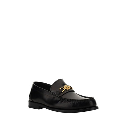 Loafer Shoes by Versace for men in bos taurus calf leather black features an dynamic silhouette from the Medusa Men's Bos Taurus Calf Leather Loafer Shoes collection, defined by a dynamic round toe style and block-heel for a dynamic look.