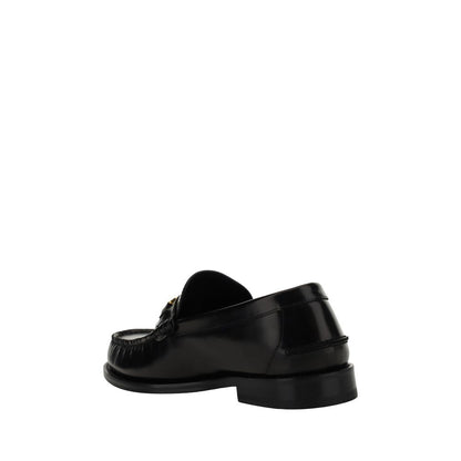Loafer Shoes by Versace for men in bos taurus calf leather black features an effortless chic silhouette, showcasing the Medusa Men's Bos Taurus Calf Leather Loafer Shoes design with an effortless chic block-heel and a round toe style for a effortless chic look.