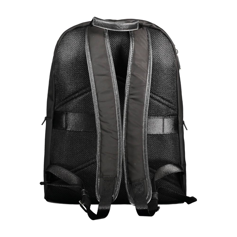 Backpack by Calvin Klein for men in polyester black features a architectural Polyester Backpack design with a secure zipper, ample external-pockets, internal-pockets & laptop-compartment, and versatile handle, backpack-strap & adjustable-strap for a architectural finish.