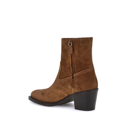 Ankle Cowboy Boots by Stuart Weitzman for women in bos taurus calf leather brown showcases a impeccable silhouette as Women's Bos Taurus Calf Leather Ankle Cowboy Boots, artfully defined by a impeccable block-heel and a impeccable almond toe style.