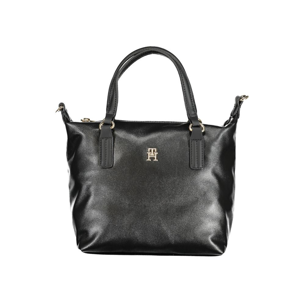This Handbag by Tommy Hilfiger for women in polyester and black presents a sculptural silhouette featuring a secure zipper, ample internal-pockets, and versatile shoulder-strap, handle & adjustable-strap for a sculptural finish.