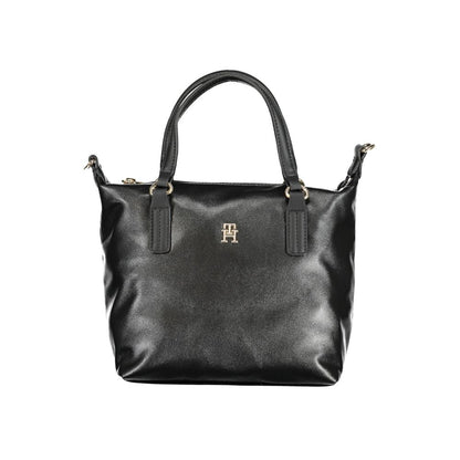 This Handbag by Tommy Hilfiger for women in polyester and black presents a sculptural silhouette featuring a secure zipper, ample internal-pockets, and versatile shoulder-strap, handle & adjustable-strap for a sculptural finish.