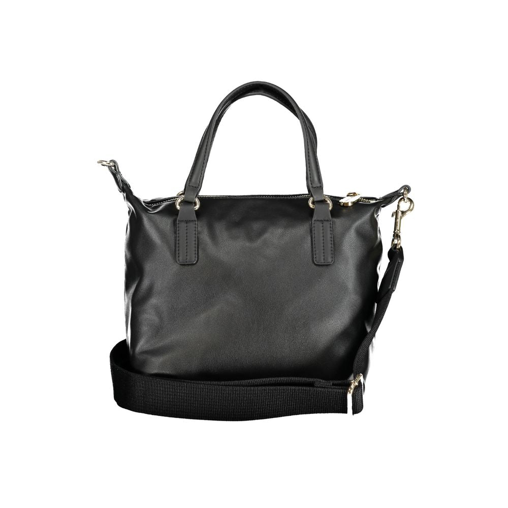 Handbag by Tommy Hilfiger for women in polyester black features an refined silhouette, showcasing a secure zipper, ample internal-pockets, and versatile shoulder-strap, handle & adjustable-strap for a sophisticated refined aesthetic.