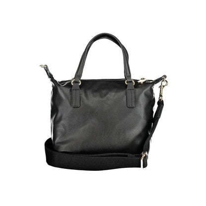 Handbag by Tommy Hilfiger for women in polyester black features an refined silhouette, showcasing a secure zipper, ample internal-pockets, and versatile shoulder-strap, handle & adjustable-strap for a sophisticated refined aesthetic.
