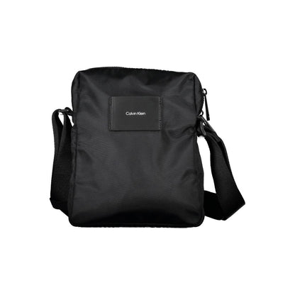 Shoulder Bag by Calvin Klein for men in polyester & polyurethane black features a effortless chic silhouette with a secure zipper, ample internal-pockets, and versatile shoulder-strap & adjustable-strap for a effortless chic finish.