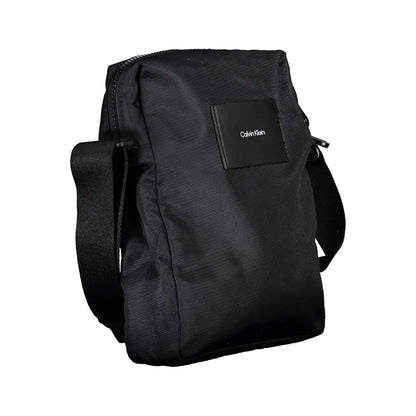 Shoulder Bag by Calvin Klein for men in polyester & polyurethane black features a statuesque silhouette, showcasing a secure zipper and statuesque internal-pockets with versatile shoulder-strap & adjustable-strap for a statuesque finish.