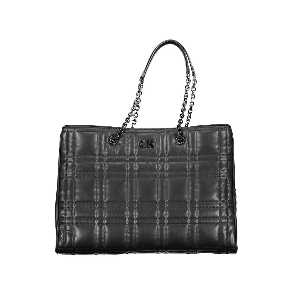 Quilted Shoulder Convertible Handbag by Calvin Klein for women in polyester faux leather black features a exquisite silhouette with a secure snap & zipper, ample built-in-compartments & internal-pockets, and versatile shoulder-strap & handle for a exquisite look.