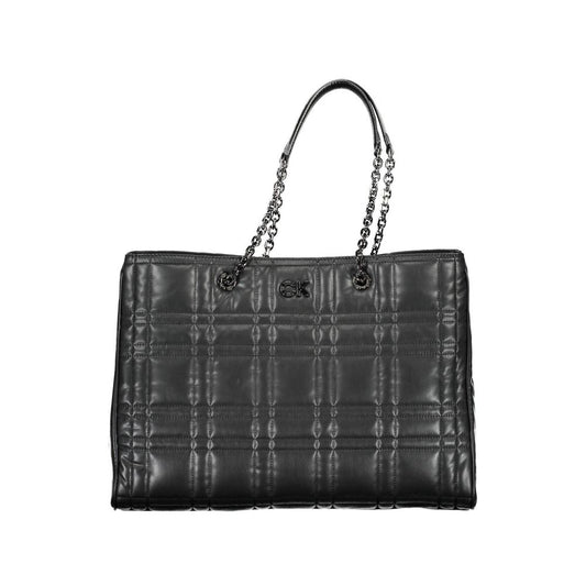 Quilted Shoulder Convertible Handbag by Calvin Klein for women in polyester faux leather black features a exquisite silhouette with a secure snap & zipper, ample built-in-compartments & internal-pockets, and versatile shoulder-strap & handle for a exquisite look.