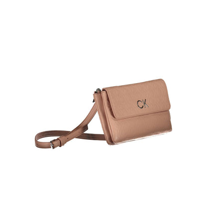 Crossbody Handbag by Calvin Klein for women in polyester faux leather pink, jacquard & signature features a refined silhouette, showcasing a secure snap & zipper, organized built-in-compartments & cardholder, and versatile crossbody-strap & adjustable-strap for a refined finish.