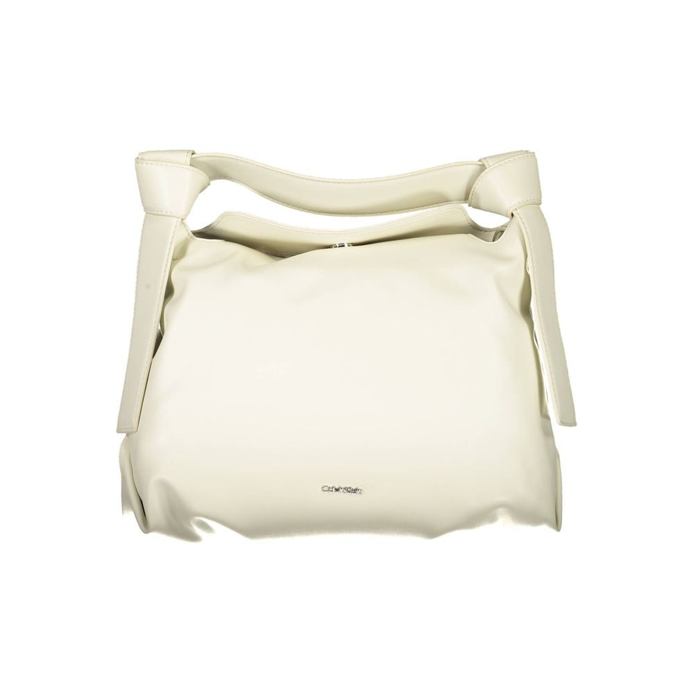 Shoulder Convertible Handbag by Calvin Klein for women in polyester faux leather beige presents a exquisite silhouette, showcasing a secure snap and organized internal-pockets with versatile shoulder-strap, handle & adjustable-strap.
