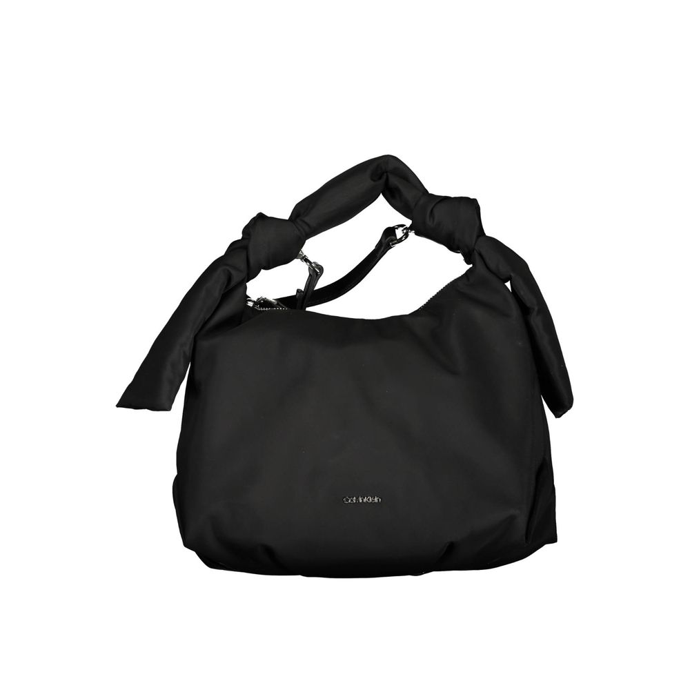 This Shoulder Handbag by Calvin Klein for women in polyester and black presents a sculptural silhouette featuring a secure zipper, ample , and versatile shoulder-strap, adjustable-strap & handle for a sculptural finish.