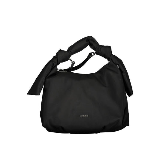 This Shoulder Handbag by Calvin Klein for women in polyester and black presents a sculptural silhouette featuring a secure zipper, ample , and versatile shoulder-strap, adjustable-strap & handle for a sculptural finish.
