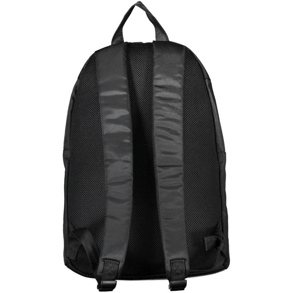 Backpack by Tommy Hilfiger for men in polyester black & print showcases a stately Polyester Backpack design, featuring a secure zipper with stately built-in-compartments, external-pockets, internal-pockets & laptop-compartment and versatile backpack-strap, adjustable-strap & handle.