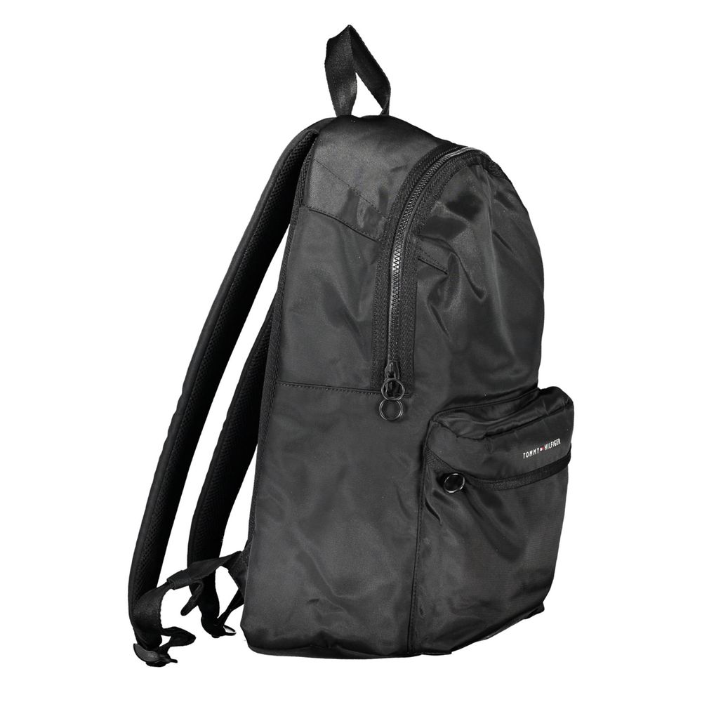Backpack by Tommy Hilfiger for men in polyester black & print features an stately silhouette from the Polyester Backpack range, with a secure zipper, ample built-in-compartments, external-pockets, internal-pockets & laptop-compartment, and versatile backpack-strap, adjustable-strap & handle.