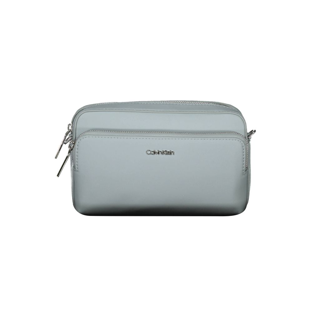 Crossbody Handbag by Calvin Klein for women in polyester faux leather blue features an refined silhouette, showcasing a secure zipper, ample internal-pockets, and versatile crossbody-strap & adjustable-strap for a sophisticated refined aesthetic.