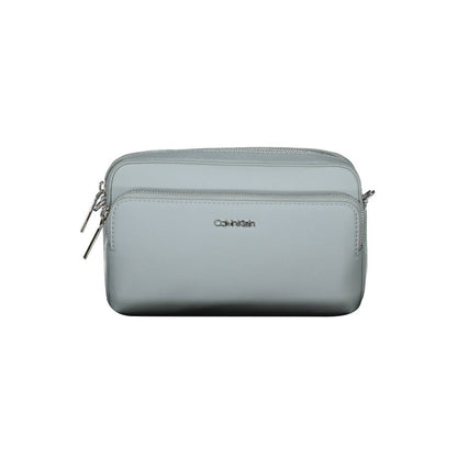 Crossbody Handbag by Calvin Klein for women in polyester faux leather blue features an refined silhouette, showcasing a secure zipper, ample internal-pockets, and versatile crossbody-strap & adjustable-strap for a sophisticated refined aesthetic.