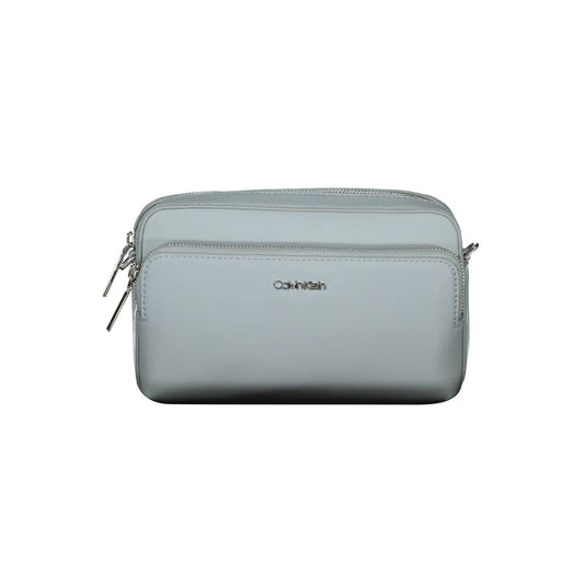 Crossbody Handbag by Calvin Klein for women in polyester faux leather blue features an refined silhouette, showcasing a secure zipper, ample internal-pockets, and versatile crossbody-strap & adjustable-strap for a sophisticated refined aesthetic.