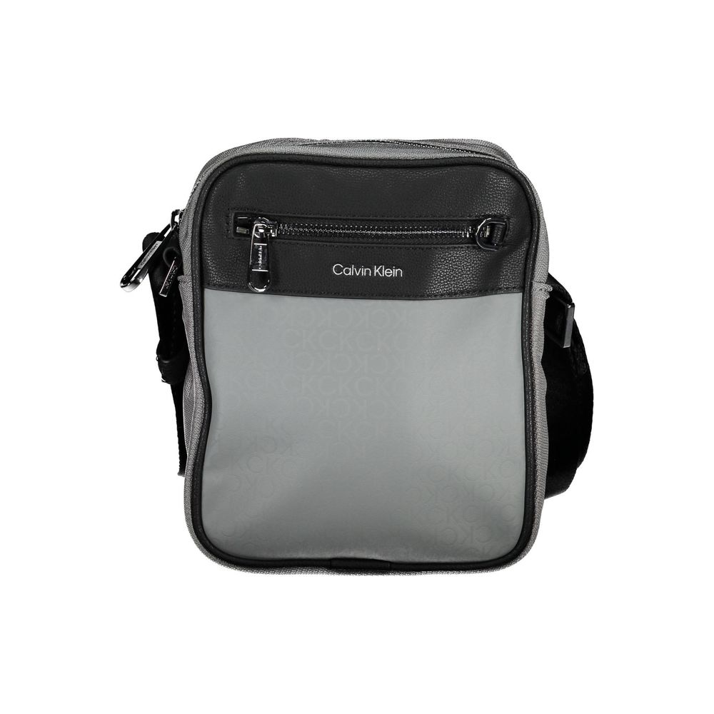 Shoulder Bag by Calvin Klein for men in polyester gray presents a statuesque silhouette, showcasing a secure zipper and statuesque external-pockets & internal-pockets with versatile shoulder-strap & adjustable-strap for a sophisticated look.