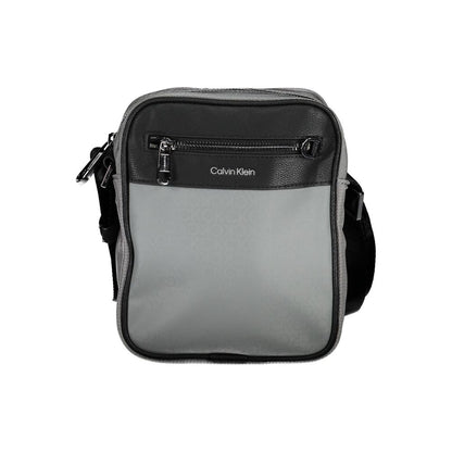 Shoulder Bag by Calvin Klein for men in polyester gray presents a statuesque silhouette, showcasing a secure zipper and statuesque external-pockets & internal-pockets with versatile shoulder-strap & adjustable-strap for a sophisticated look.