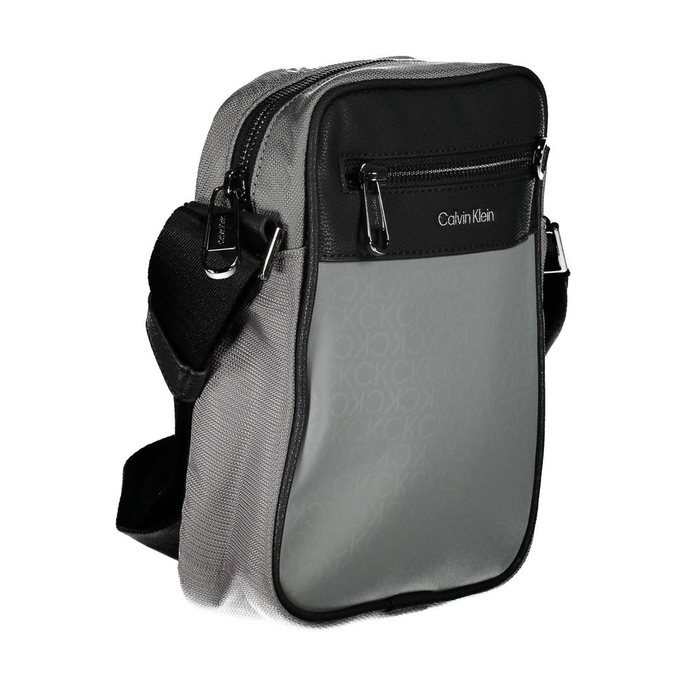Shoulder Bag by Calvin Klein for men in polyester gray features a effortless sophistication silhouette, secured by a zipper with ample external-pockets & internal-pockets and versatile shoulder-strap & adjustable-strap for a effortless sophistication finish.