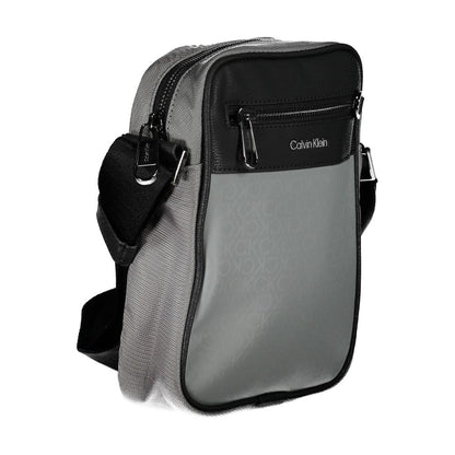 Shoulder Bag by Calvin Klein for men in polyester gray features a effortless sophistication silhouette, secured by a zipper with ample external-pockets & internal-pockets and versatile shoulder-strap & adjustable-strap for a effortless sophistication finish.