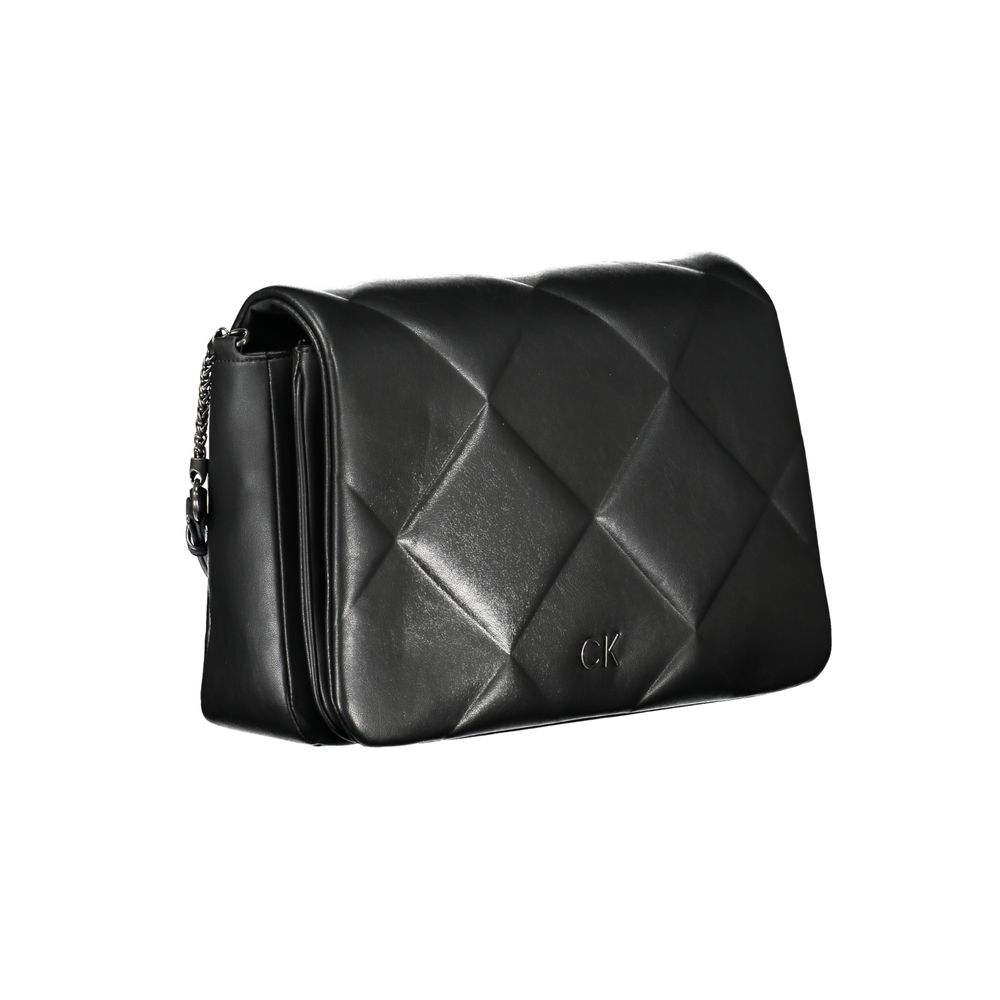 Crossbody Quilted Handbag by Calvin Klein for women in polyester faux leather black features a ornamental silhouette, showcasing a secure zipper & magnetic, ample internal-pockets, and ornamental crossbody-strap & adjustable-strap for a sophisticated look.
