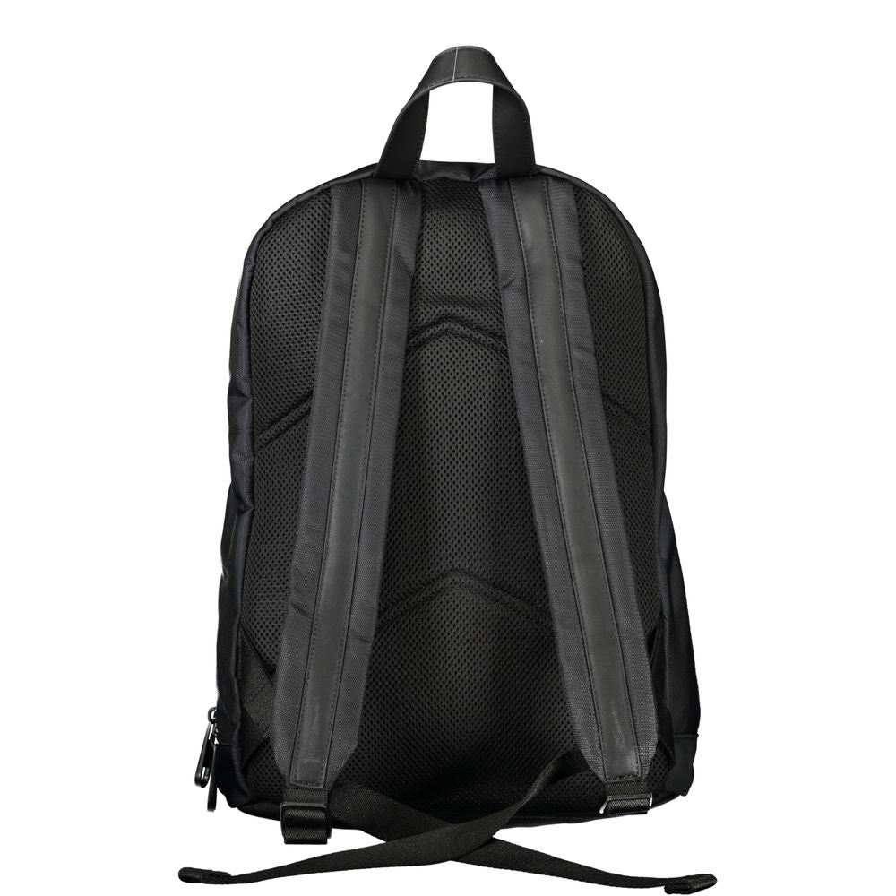 Backpack by Calvin Klein for men in polyester black features a refined silhouette, showcasing the Polyester Backpack design with a secure zipper, ample external-pockets, internal-pockets & laptop-compartment, and versatile backpack-strap, adjustable-strap & handle.