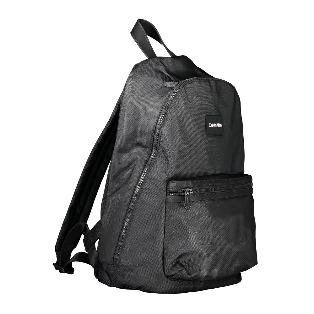 Backpack by Calvin Klein for men in polyester black features a architectural Polyester Backpack design with a secure zipper, ample external-pockets, internal-pockets & laptop-compartment, and versatile backpack-strap, adjustable-strap & handle for a architectural finish.