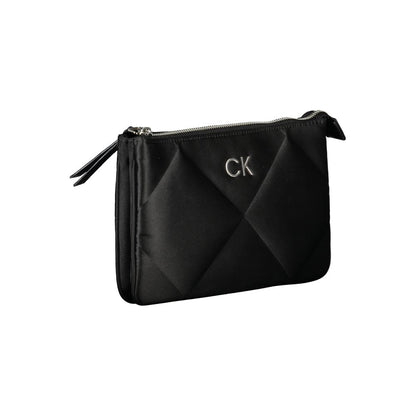 This Quilted Shoulder Handbag by Calvin Klein for women in polyester and black presents a sculptural silhouette featuring a secure zipper, ample built-in-compartments & cardholder, and versatile shoulder-strap & adjustable-strap for a sculptural finish.