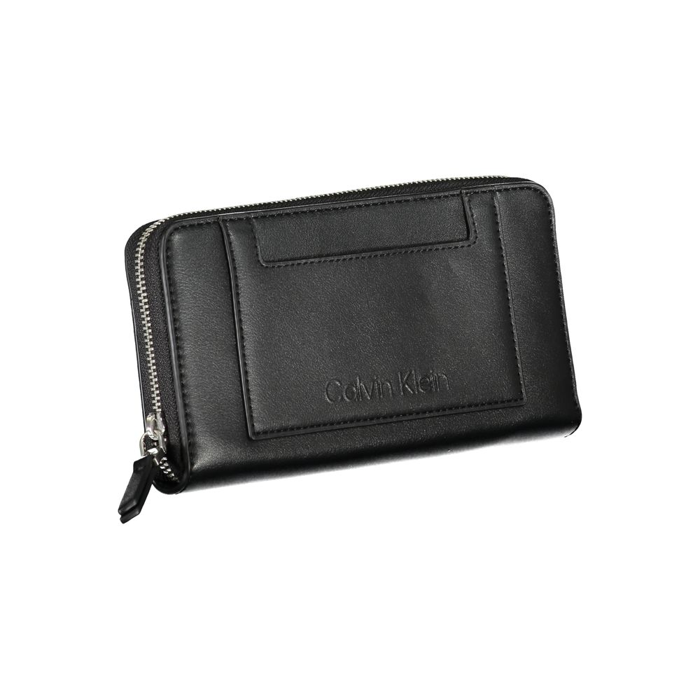 Wallet by Calvin Klein for women in polyester black presents a architectural silhouette from the Polyester Wallet collection, showcasing architectural coin-purse for a architectural finish.