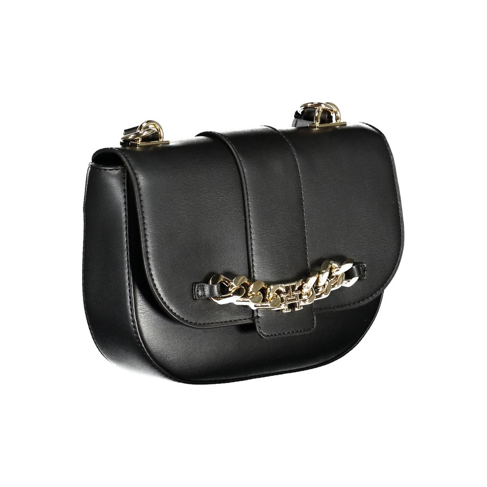 This Shoulder Handbag by Tommy Hilfiger for women in polyethylene and black presents a sculptural silhouette featuring a secure snap, ample internal-pockets, and versatile shoulder-strap & adjustable-strap for a sculptural finish.