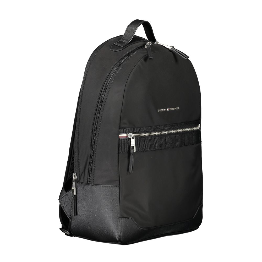 Backpack by Tommy Hilfiger for men in polyester black features a architectural Polyester Backpack design with a secure zipper, ample external-pockets & laptop-compartment, and versatile handle, backpack-strap & adjustable-strap for a architectural finish.