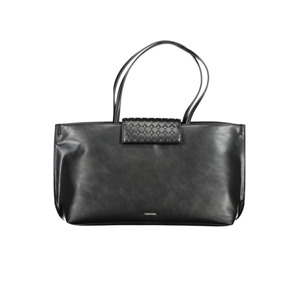 Tote Convertible Handbag by Calvin Klein for women in polyester faux leather black features an exquisite silhouette, showcasing a secure magnetic, ample internal-pockets, and exquisite handle for a sophisticated finish.
