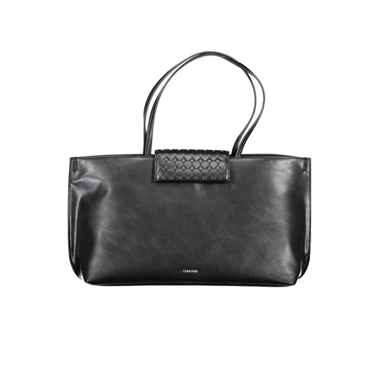 Tote Convertible Handbag by Calvin Klein for women in polyester faux leather black features an exquisite silhouette, showcasing a secure magnetic, ample internal-pockets, and exquisite handle for a sophisticated finish.