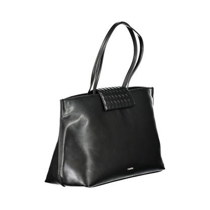 Tote Convertible Handbag by Calvin Klein for women in polyester faux leather black features an exquisite silhouette, showcasing a secure magnetic, ample internal-pockets, and versatile handle for exquisite style.