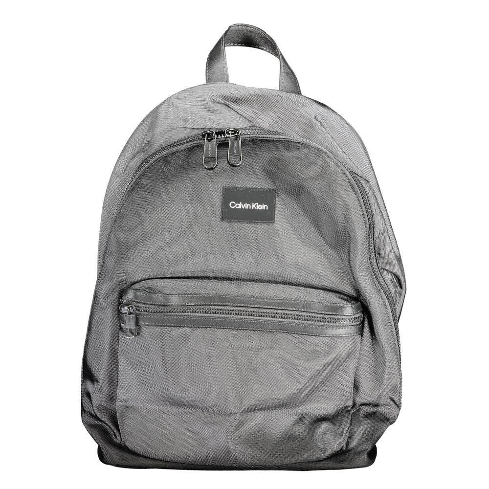 Backpack by Calvin Klein for men in polyester black features a stately Polyester Backpack design, showcasing a secure zipper, ample external-pockets, internal-pockets & laptop-compartment, and versatile backpack-strap, adjustable-strap & handle for a stately finish.