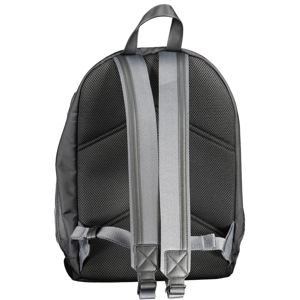 Backpack by Calvin Klein for men in polyester black presents a stately Polyester Backpack design, showcasing a secure zipper with ample external-pockets, internal-pockets & laptop-compartment and versatile backpack-strap, adjustable-strap & handle for a stately finish.