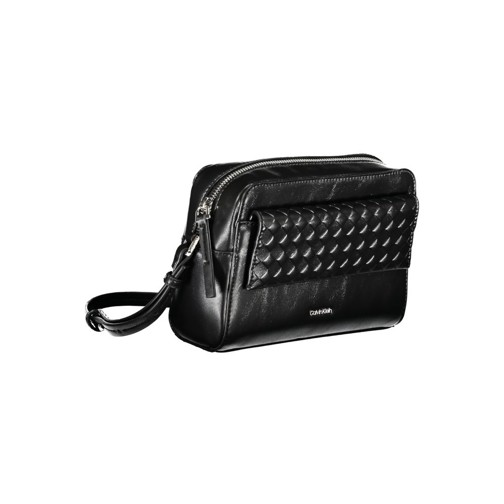 Crossbody Convertible Handbag by Calvin Klein for women in polyester faux leather black features a refined silhouette, showcasing a secure zipper & magnetic and refined external-pockets & cardholder with versatile crossbody-strap & adjustable-strap for a refined finish.