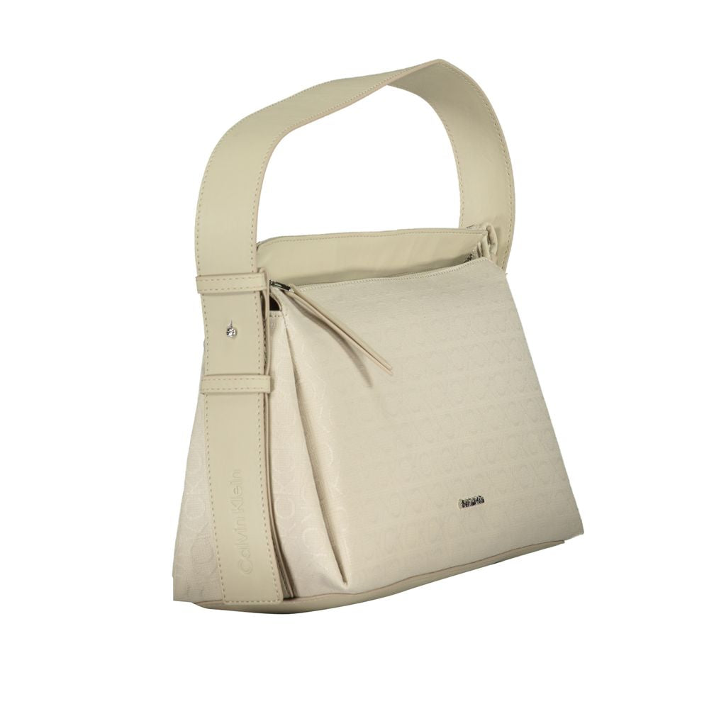 Shoulder Convertible Handbag by Calvin Klein for women in polyester beige features an exquisite silhouette, showcasing a secure zipper, ample document-holder, and exquisite shoulder-strap, adjustable-strap & handle for a sophisticated finish.
