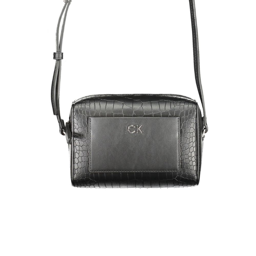 Crossbody Handbag by Calvin Klein for women in polyester embossed faux leather black presents a ornamental silhouette, showcasing a secure zipper, ample external-pockets & cardholder, and versatile crossbody-strap & adjustable-strap for a ornamental finish.