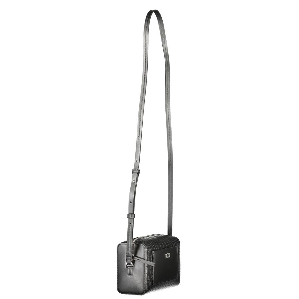 Crossbody Handbag by Calvin Klein for women in polyester embossed faux leather black presents a ornamental silhouette, showcasing a secure zipper, ample external-pockets & cardholder, and versatile crossbody-strap & adjustable-strap for a ornamental finish.