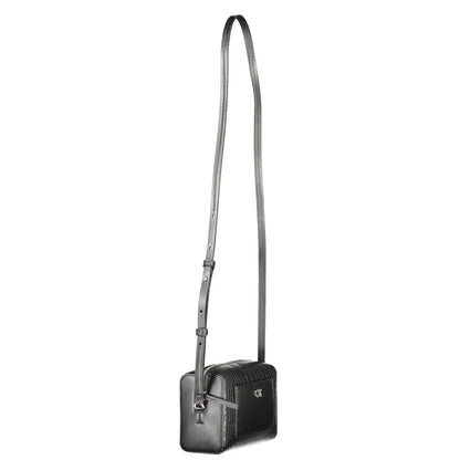 Crossbody Handbag by Calvin Klein for women in polyester embossed faux leather black presents a ornamental silhouette, showcasing a secure zipper, ample external-pockets & cardholder, and versatile crossbody-strap & adjustable-strap for a ornamental finish.