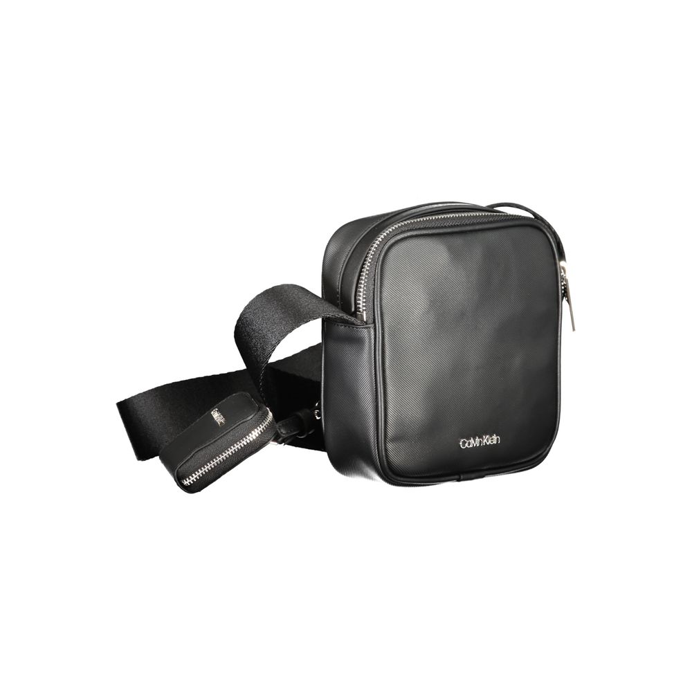 Shoulder Bag by Calvin Klein for men in polyester black features a effortless chic silhouette with a secure zipper, ample removable-pouch, internal-pockets & coin-purse, and versatile shoulder-strap & adjustable-strap for a effortless chic finish.