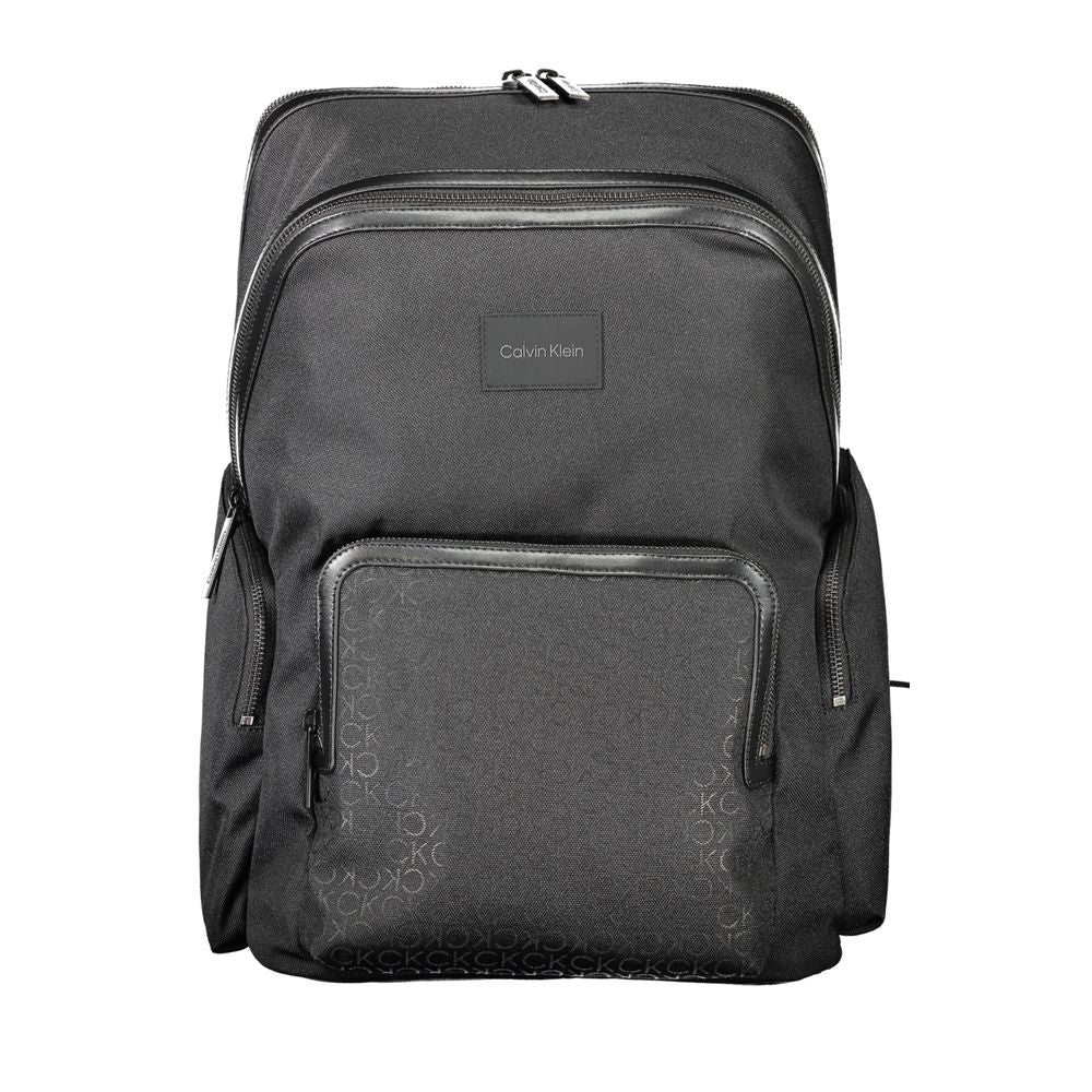 Backpack by Calvin Klein for men in polyester black & signature features a stately Polyester Backpack design, showcasing a secure zipper, ample external-pockets, internal-pockets & laptop-compartment, and versatile backpack-strap, adjustable-strap & handle for a stately finish.