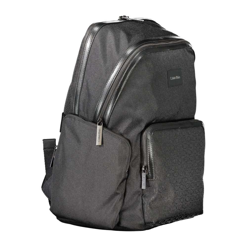 Backpack by Calvin Klein for men in polyester black & signature showcases a stately Polyester Backpack design, featuring a secure zipper with stately external-pockets, internal-pockets & laptop-compartment and versatile backpack-strap, adjustable-strap & handle.
